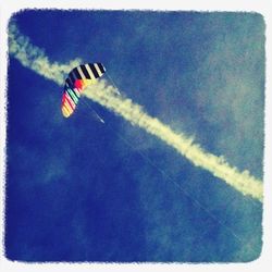 Low angle view of kite flying in sky