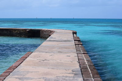 Scenic view of sea against blue sky