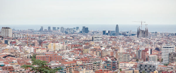 Aerial view of cityscape against sky