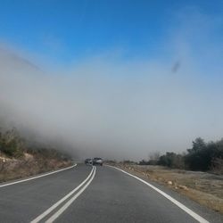 Road against cloudy sky