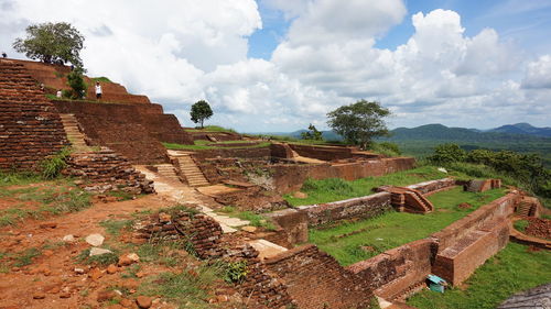 Old ruins of building against cloudy sky