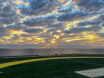 Scenic view of beach against sky during sunset
