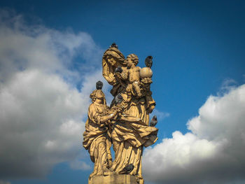 Low angle view of statue against sky