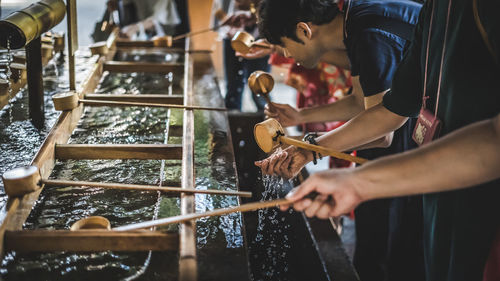 Midsection of man preparing food