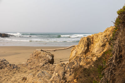 Scenic view of beach against clear sky