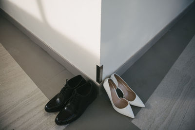 High angle view of shoes on hardwood floor at home