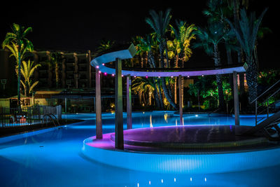 View of swimming pool at night