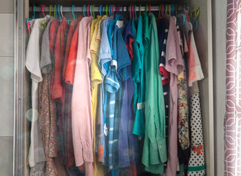 Clothes hanging on rack in store