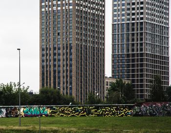 View of park against buildings in city