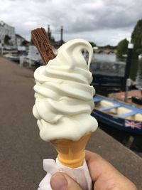 Close-up of hand holding ice cream cone