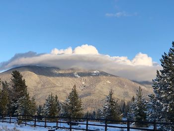 Scenic view of mountains against sky during winter