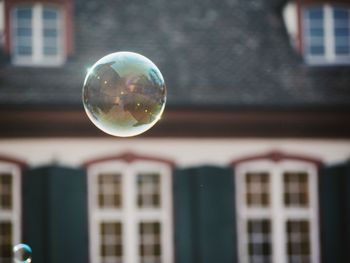 Close-up of bubbles against building