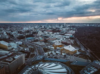 High angle view of buildings by sea against sky