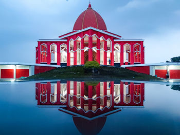 Digital composite image of traditional building against sky