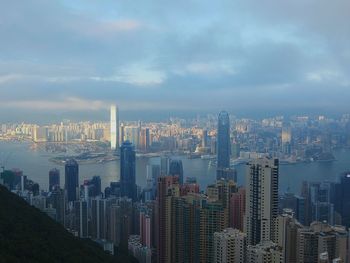 City skyline against cloudy sky