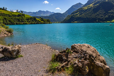 Scenic view of lake and mountains against sky