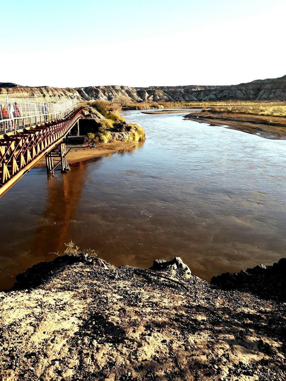 BRIDGE OVER RIVER AGAINST CLEAR SKY