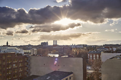 High angle view of buildings against sky during sunset