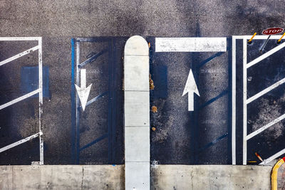 High angle view of arrow sign on road