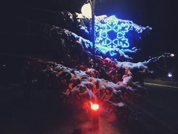 Light painting on snow against sky at night