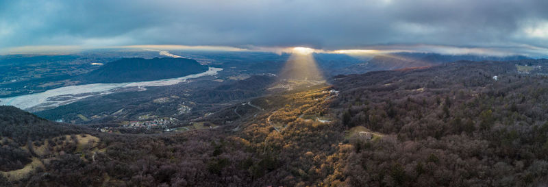 Aerial view of landscape against cloudy sky