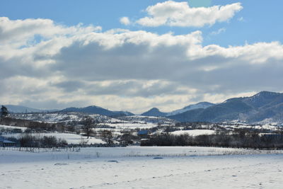 Scenic view of snowcapped mountains against sky