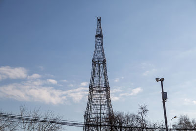 Low angle view of electricity pylon against clear sky