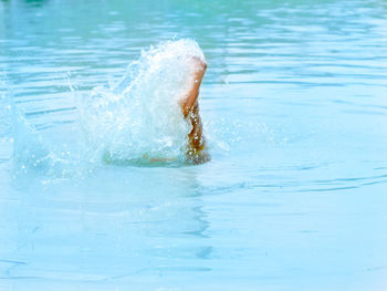 Low section of person in pool