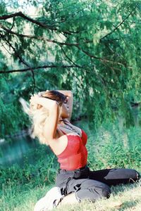 Woman sitting on field