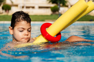 Boy swimming in pool