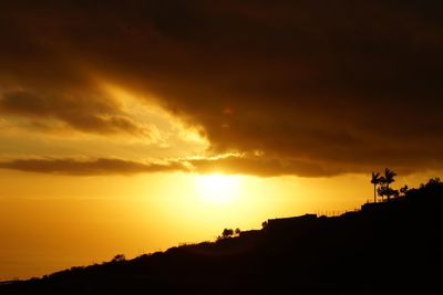 Scenic view of dramatic sky during sunset