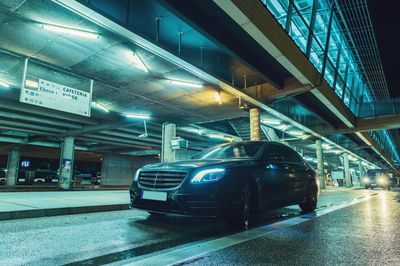 Illuminated parking lot in city at night