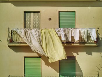 Clothes drying on clothesline at home