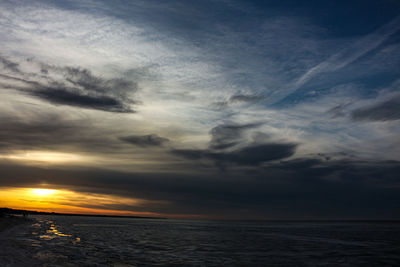 Scenic view of sea against dramatic sky