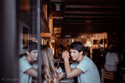 Group of people in drinking glass at night