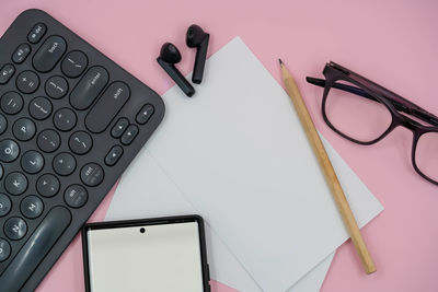 High angle view of eyeglasses and pen on table