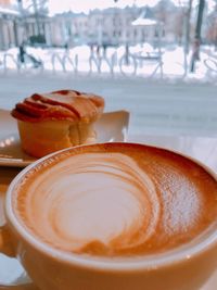 Close-up of cappuccino on table