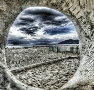 Scenic view of sea against cloudy sky