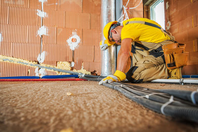 Man working on wall