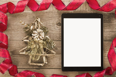 High angle view of red and white flowers on table