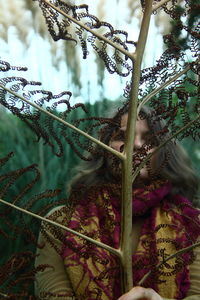 Close-up of cat on plant