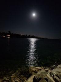 Scenic view of moon against clear sky at night