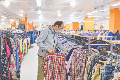 Full length of man standing at store