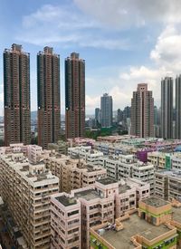 Modern buildings in city against sky