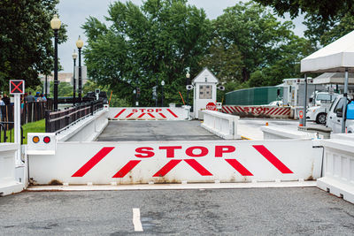 Text on road by building in city