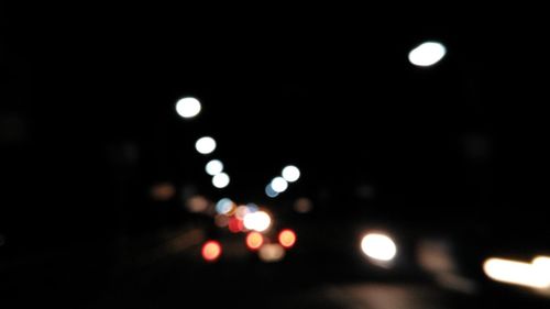 Defocused image of illuminated lights at night