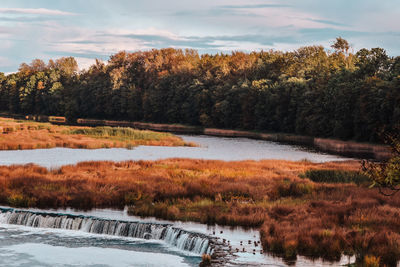 Scenic view of lake against sky during autumn