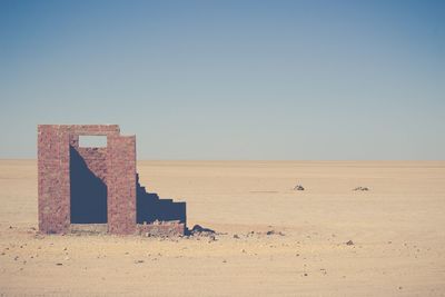 Scenic view of desert against clear sky