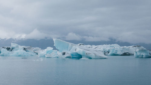 Scenic view of frozen sea against sky