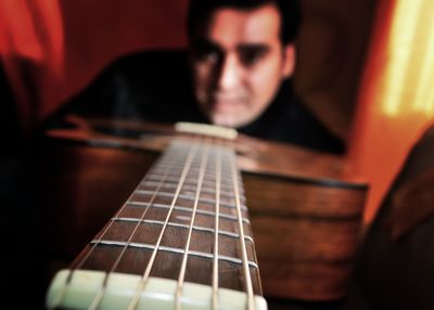 Close-up of playing guitar